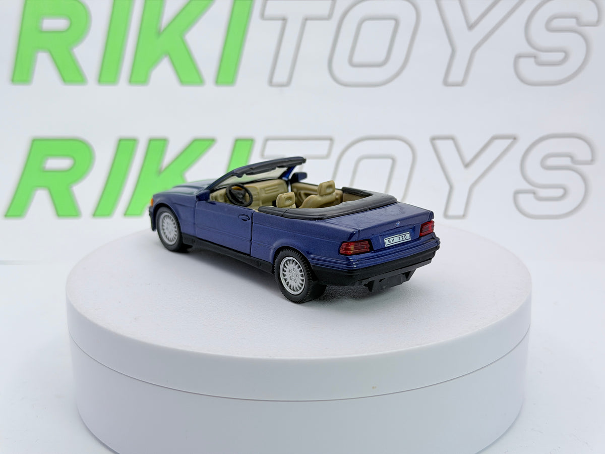 BMW 325 i Cabrio E36 Cararama 1/43 Blu