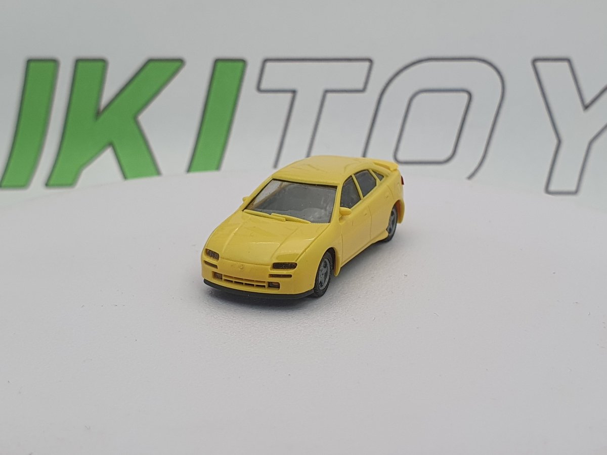 Mazda 323 F Herpa 1/87 Giallo 1994 - RikiToys - Herpa