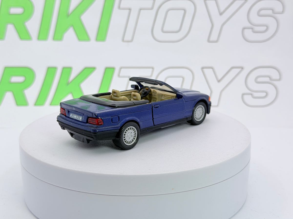 BMW 325 i Cabrio E36 Cararama 1/43 Blu