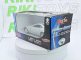Cadillac Evoq Coupé Maisto 1/40 Argento - RikiToys - Maisto#