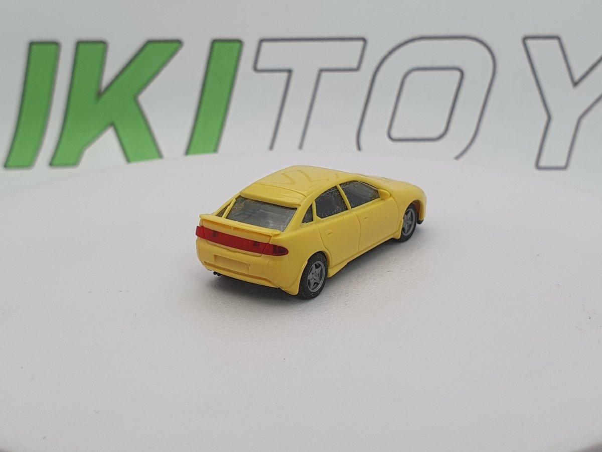 Mazda 323 F Herpa 1/87 Giallo 1994 - RikiToys - Herpa