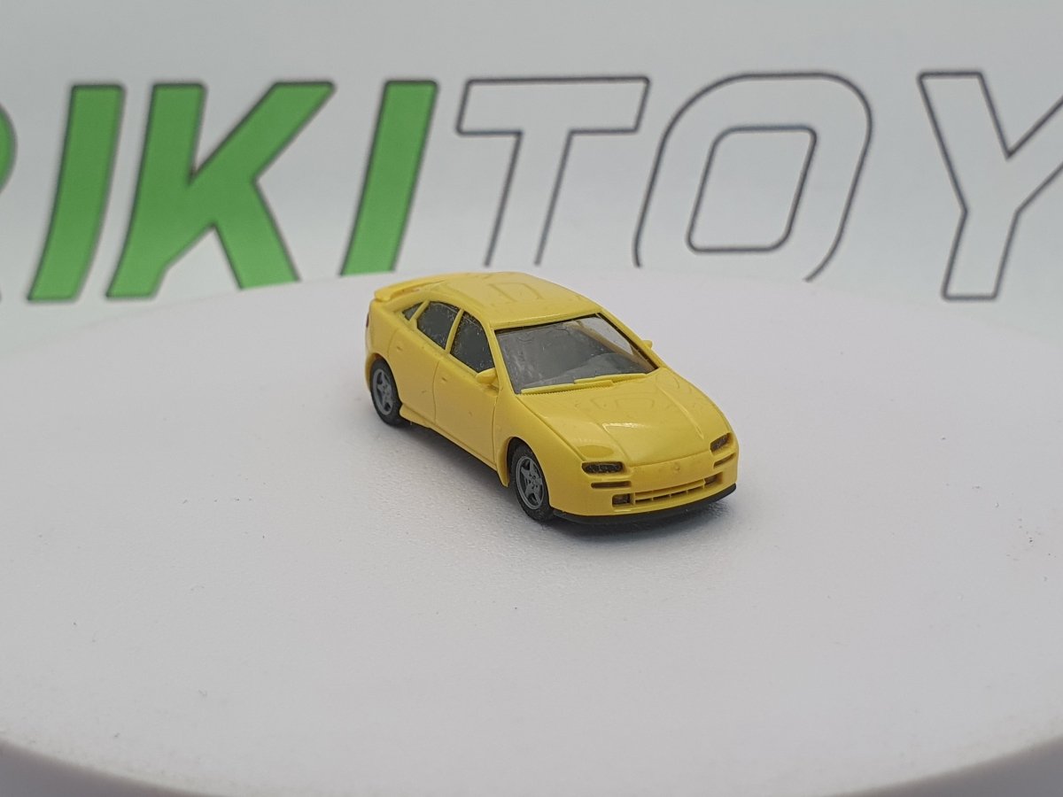 Mazda 323 F Herpa 1/87 Giallo 1994 - RikiToys - Herpa