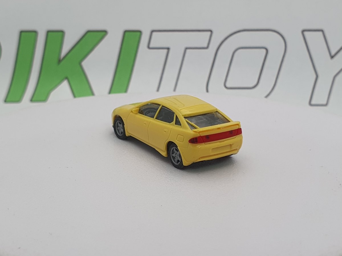 Mazda 323 F Herpa 1/87 Giallo 1994 - RikiToys - Herpa